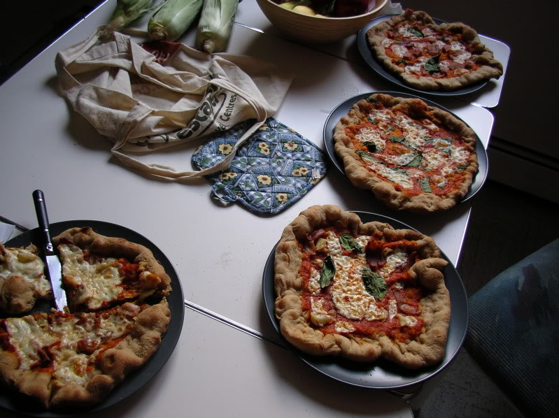 Several pizzas on a table.